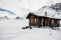 Traditional wooden chalet and snowy winter landscape, Melchsee-Frutt, Canton of Obwalden, Switzerland