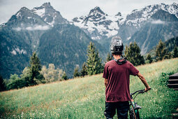 Portrait of a young Mountainbiker, Mountainbike, Hut, Brandnertal, Vorarlberg, Austria