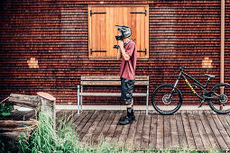 Portrait of a young Mountainbiker, Mountainbike, Hut, Brandnertal, Vorarlberg, Austria