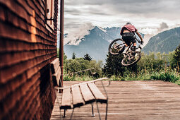 Portrait of a young Mountainbiker, Mountainbike, Jump, Hut, Brandnertal, Vorarlberg, Austria