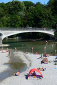 Bathing in summer at the Kabelsteg, Isar river, Munich, Bavaria, Germany