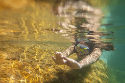 Young woman in a swimming spot in river Fango near Galeria, Corsica, Southern France, France, Southern Europe