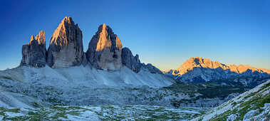 Panorama with sunrise at Tre Cime and Monte Cristallo, from hut Rifugio Locatelli, Sexten Dolomites, Dolomites, UNESCO World Heritage Dolomites, South Tyrol, Italy