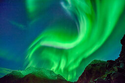 Aurora borealis, Aurora above snow-covered mountains, Lofoten, Norland, Norway