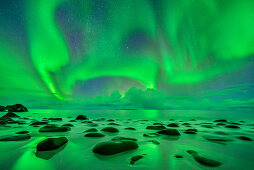 Aurora borealis, Aurora above beach and Northern Atlantic Ocean, Lofoten, Norland, Norway