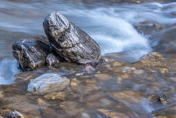 River landscape with stones in the evening, Spielmannsau, ice water, reflection, winter sun, Allgaeu, Oberallgaeu, Oberstdorf, Germany