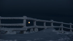 Full moon behind a frozen fence, Winter landscape, Schierke, Brocken, Harz national park, Saxony, Germany