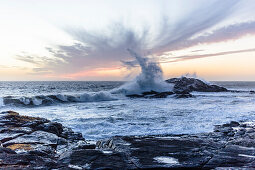 A storm blowing a 10 meter breaker over the cliffs of the Atlantic coast near Luederitz, Karas, Namibia