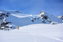 Woman backcountry skiing ascending towards Breiter Grieskogel, Breiter Grieskogel, Stubai Alps, Tyrol, Austria