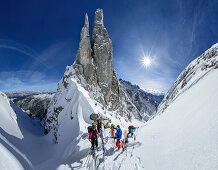 Several persons backcountry skiing standing in notch Manndlkogelscharte, Manndlkogelscharte, Gosau group, Dachstein, UNESCO World Heritage Site Salzkammergut-Dachstein, Salzburg, Austria