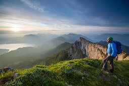 Hiker at Mount Schafberg, view to Lake Attersee, St. Wolfgang, Upper Austria, Austria, Europe