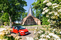 church of Ludorf, red car, Mecklenburg lakes, Mecklenburg lake district, Mecklenburg-West Pomerania, Germany, Europe