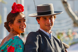 horseriding couple at the Feria de Abril, Seville Fair, spring festival, Sevilla, Seville, Andalucia, Spain, Europe