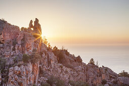 Sunset by the remarkable heart of the Calanche, west coast between Porto and Piana, West Corsica, Corsica, Southern France, France, Southern Europe, Europe