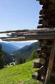 Little wooden hay cabin facing the valley, Geisler peaks, Dolomites, South Tirol, Italy