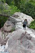 old lady carrying firewood on her back, Theth, Albanian alps, Albania