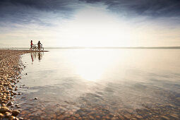 man and woman, eBike, Lakeshore, Muensing, Upper Bavaria, Germany