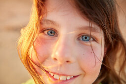 Portrait of a 8 year old girl smiling,  roche beach, andalusia, southwest coast spain, atlantc, Europe