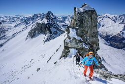 Two persons backcountry skiing ascending towards Grundschartner, Grundschartner, Zillertal Alps, Tyrol, Austria