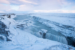 The Gullfoss Falls waterfall on the river Hvítá (Hvita) in snowy landscape in winter, Gullfoss, Gullfossi, Vesturland, Iceland, Europe