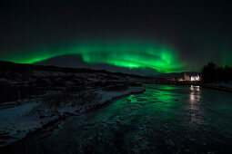 Aurora borealis (Northern Lights) and pingvallakirkja Church at Thingvellir National Park (pingvellir National Park) in winter at night, Pingvellir National Park, Sudurland, Iceland, Europe