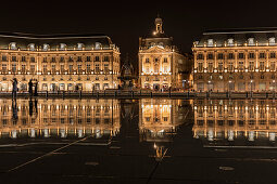 Place de la Bourse is reflected in the Miroir d'eau fountain at night