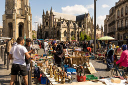 People at flea market in front of Basilica of Saint Michael at Place Meynard