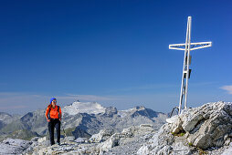 Woman hiking standing at summit of Grosses Mosermandl, Ankogel in background, Grosses Mosermandl, valley Riedingtal, Radstadt Tauern, Lower Tauern, Carinthia, Austria