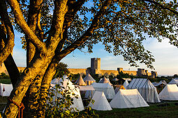 City wall of the old town of Visby, tent camp Medieval festival in front of the old city wall, Schweden