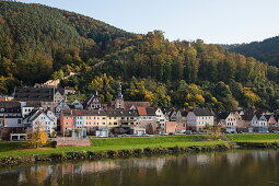 View across Main river to town and Burg Freudenberg castle in autumn, Freudenberg, near Miltenberg, Spessart-Mainland, Franconia, Bavaria, Germany