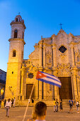 Cathedral at Havana, tourists with cuban flag, Havana Vieja, Plaza de la Cathedrale, historic town, center, old town, family travel to Cuba, parental leave, holiday, time-out, adventure, Havana, Cuba, Caribbean island