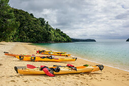Several kayaks laying in bay, Abel Tasman Coastal Track, Great Walks, Abel Tasman National Park, Tasman, South island, New Zealand
