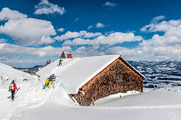 People on a snowshoe tour through a snowy landscape, Illertal, Hoernerdoerfer, Allgau, Baden-Wuerttemberg, Germany, Europe
