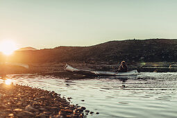 Men with a rowing boat in greenland, greenland, arctic.