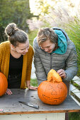 Children with pumpkin on Halloween, Hamburg, Germany