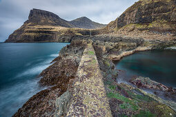 view from the old quay wall to the  Gasadalur waterfall, Vagar, Faroe islands, Denmark