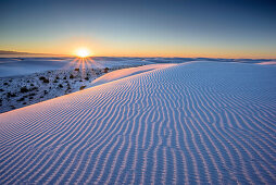 Sunrise over white sand dunes, White Sands National Monument, New Mexico, USA