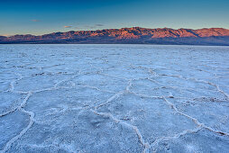 Salt deposit in salt pan at sunrise, Badwater Basin, Death Valley National Park, California, USA