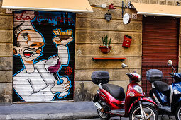 Graffiti on the door of la raffineria, restaurant in Livorno, Italy, Europe