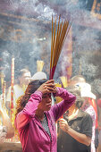 Woman visit pagoda for new year in Saigon, Vietnam, Asia