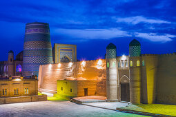 Kalta Minor minaret and city wall in Khiva, Uzbekistan, Asia