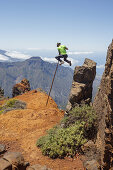 man jumping with the canarian crook, Salto del Pastor Canario, crater rim, Caldera de Taburiente, UNESCO Biosphere Reserve, La Palma, Canary Islands, Spain, Europe