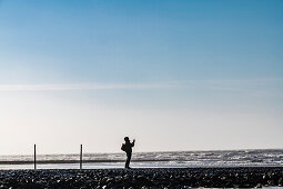 Stroller takes a souvenir photo, Wangerooge, East Frisia, Lower Saxony, Germany