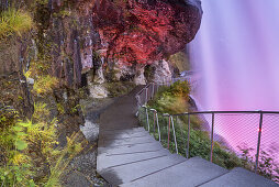Behind the illuminated waterfall  Steinsdalsfossen in Norheimsund, Hordaland, Fjord norway, Southern norway, Norway, Scandinavia, Northern Europe, Europe