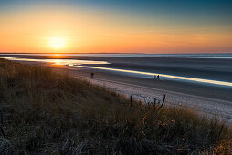 sunset the beach  in winter, East Frisian Islands, Spiekeroog, Lower Saxony, North Sea, Germany