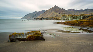 Rock on sandy beach  near the village of Djupivogur, Eastfjords, Iceland