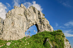 Rock arch with crucifix, Grigna, Bergamasque Alps, Lombardy, Italy