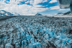 flying above the glaciers of the Alaska Mountain Range, Alaska, USA