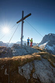 two women on Hahnkampl peak  Lamsenspitze in the back ,  Eastern Karwendel Range, Tyrol, Austria