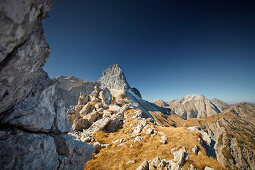 two women on the ridge of Schafjoechl, Lamsenspitze in the back,  Eastern Karwendel Range, Tyrol, Austria